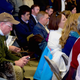 A man checks his phone at a town hall for Jeb Bush on Saturday in Bedford, New Hampshire.